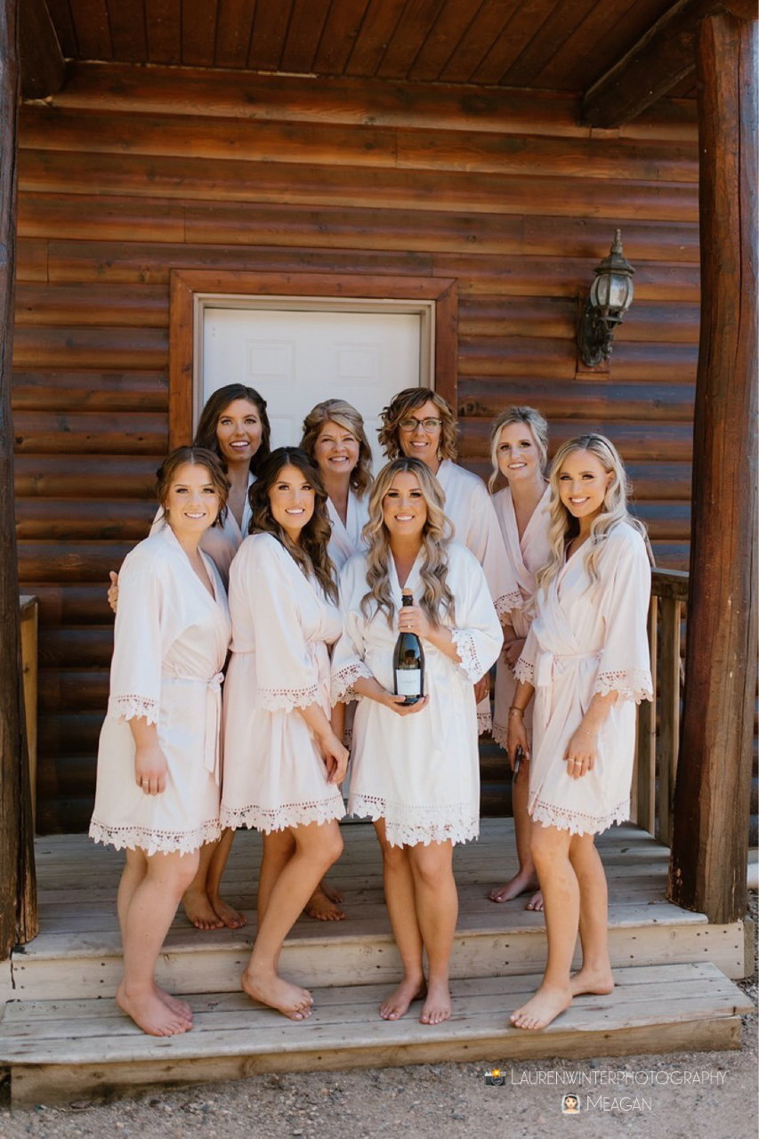 431 the wedding company customer wearing bridal party wearing Aurora satin blush and white robes 