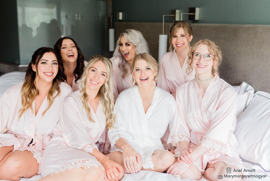 431 the wedding company customer wearing bridal party wearing Aurora satin blush and white robes 