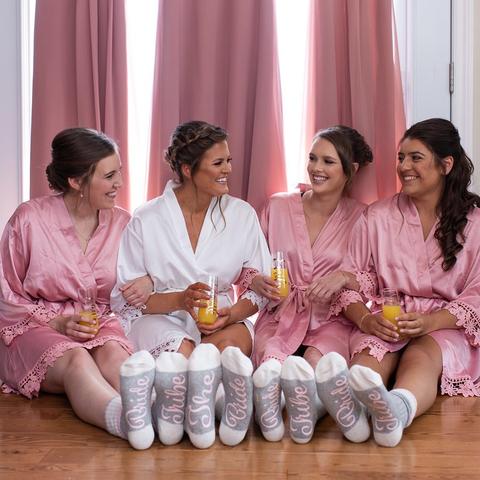 Bridal party wearing Aurora satin dusty rose robes. 431 the wedding company customer