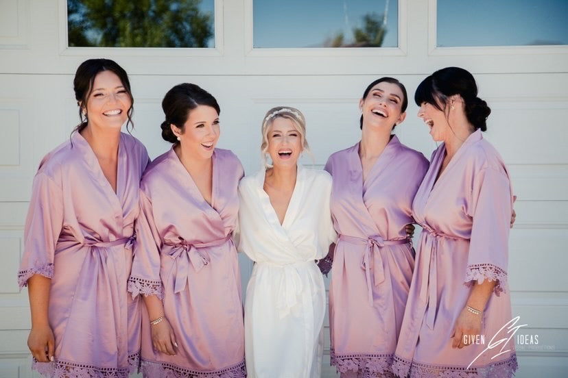 Bridal party wearing Aurora satin mauve and white robes. 431 the wedding company customer