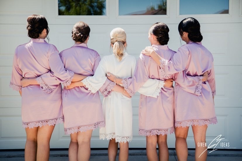 Bridal party wearing Aurora satin mauve and white robes. back view of robes. 431 the wedding company customer