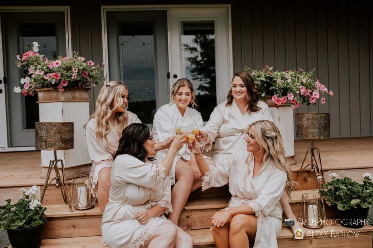 Bridal party group photo featuring the champagne satin robes