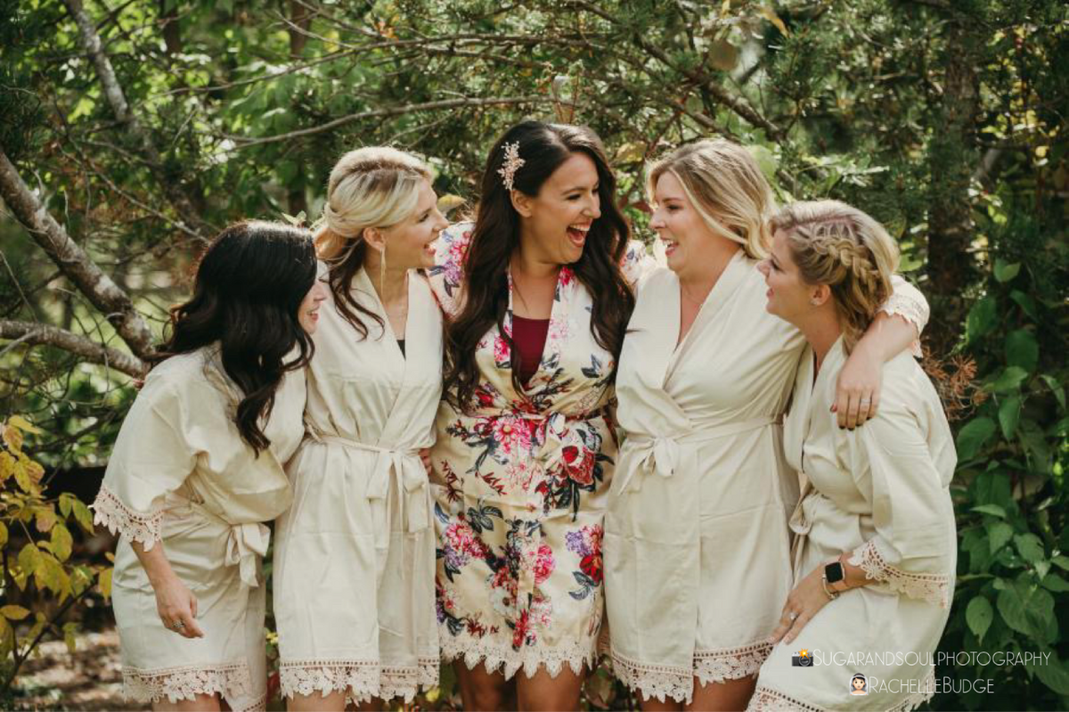 Bridal party group photo featuring the champagne satin aurora robes
