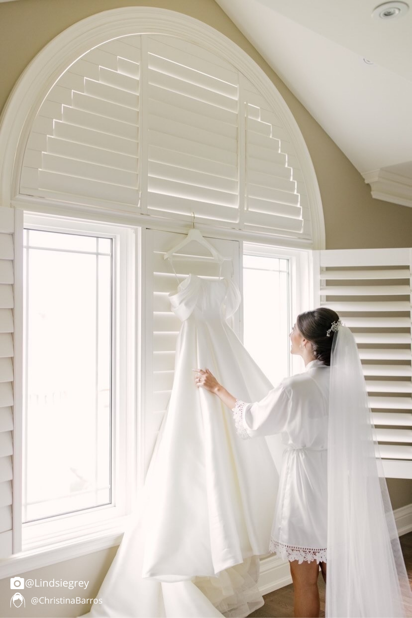 Customer wearing the Aurora white satin bridal robe.